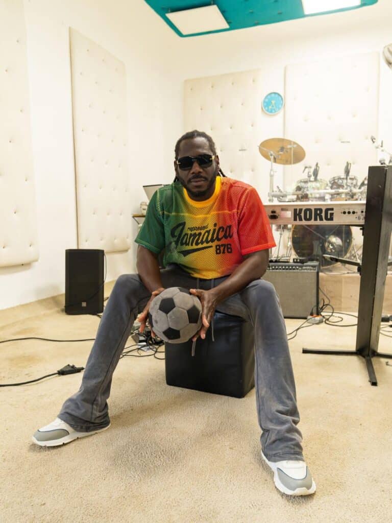 Skatta Burrell in his studio in Jamaica, surrounded by music production equipment