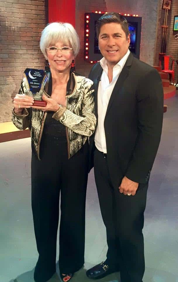 Rita Moreno on a Spanish-language television show, receiving a trophy