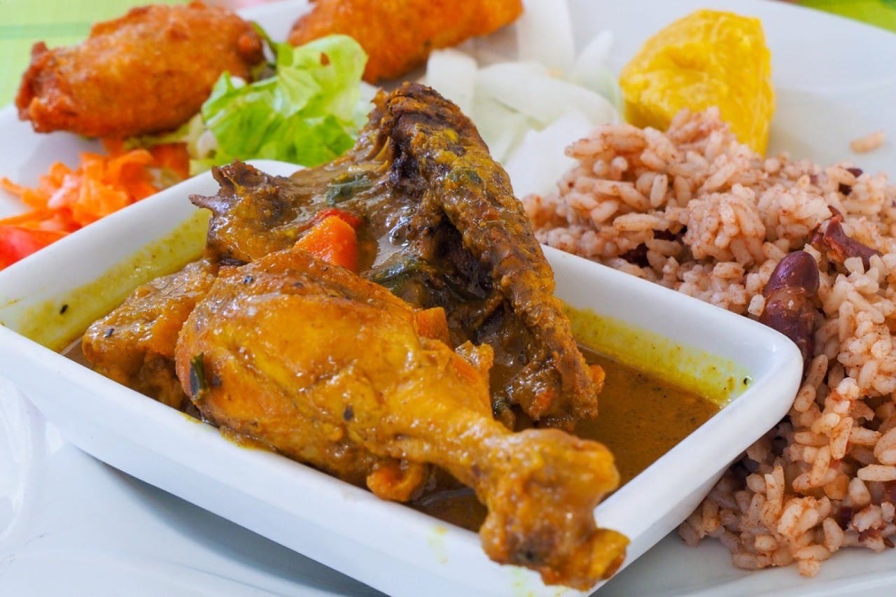 Colombo de Guadeloupe served with rice and accras